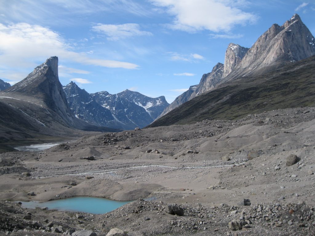 Mount Thor and Mount Northumbria fronted by a small lake and a stream