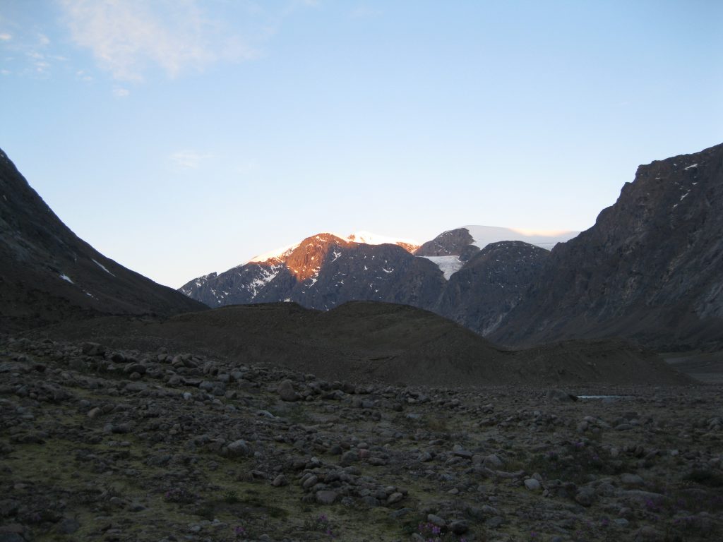 Golden Hour on Peaks and Glaciers with Reflection in a pond between Windy Lake and Schwarzenbach Falls