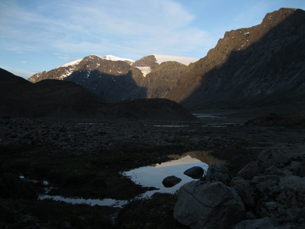 Sunlight on Peaks and Glaciers with Reflection in a pond between Windy Lake and Schwarzenbach Falls